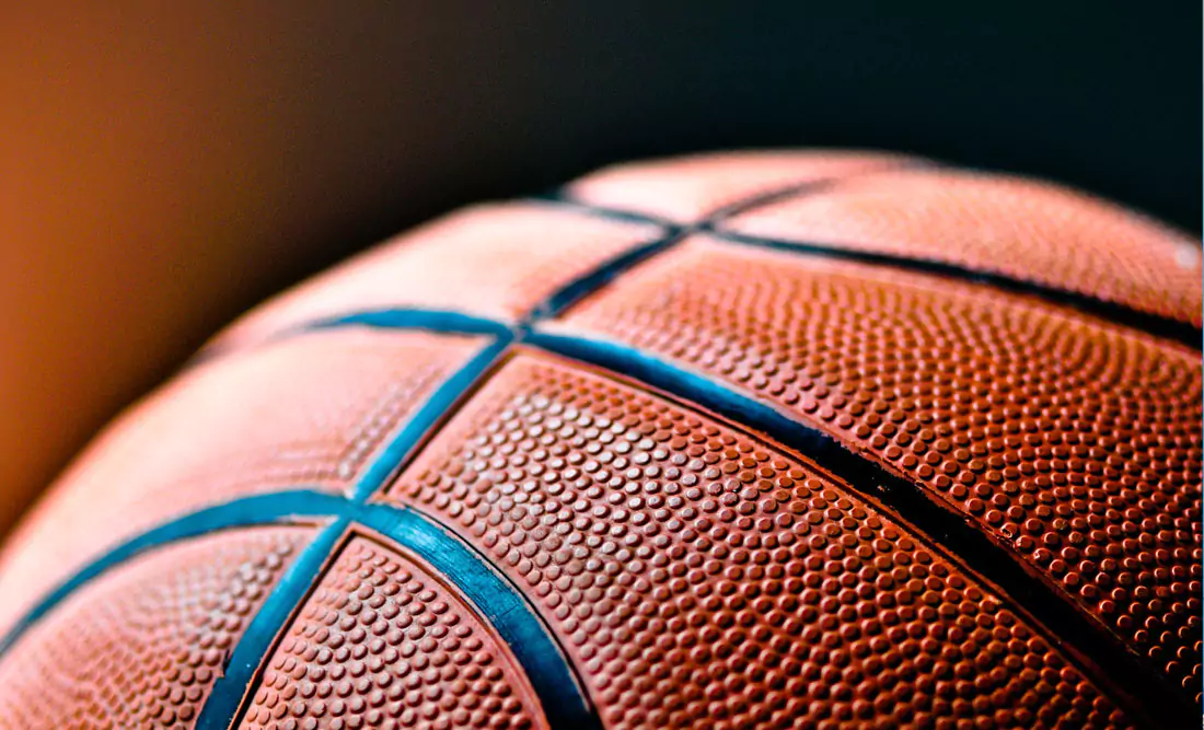 Close up of a basketball. Photo by Kylie Osullivan on Unsplash